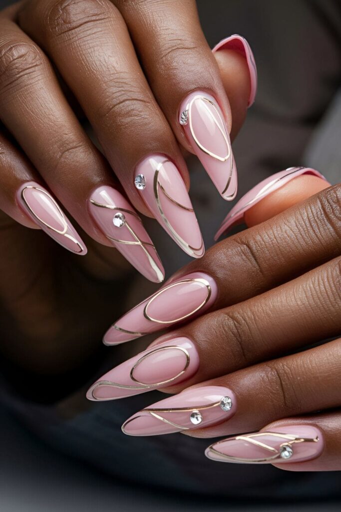 Acrylic nails combining pink and nude shades, with pink accents on nude nails, designed for dark skin tones