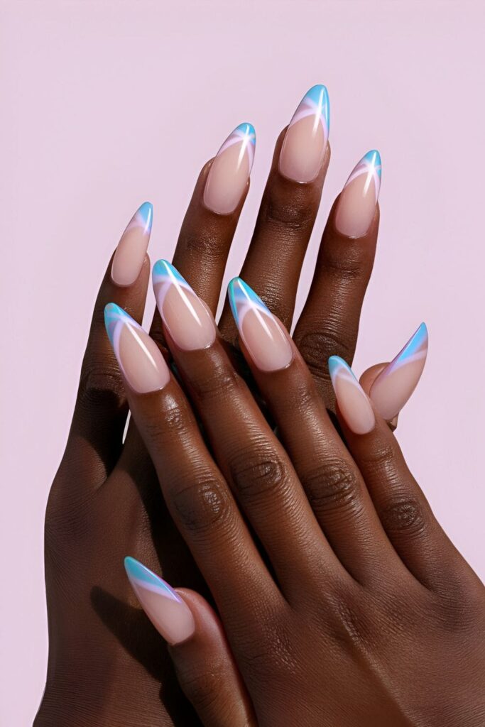 Acrylic nails in soft pink and blue pastel shades, with stripes and dots, designed to complement dark skin tones