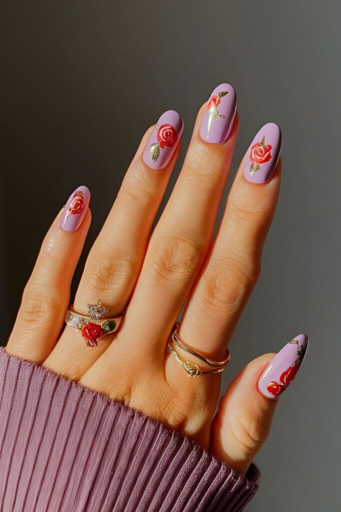 Acrylic nails with a light purple base, adorned with hand-painted vintage roses in shades of red and pink for a romantic and classic look