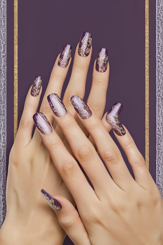 Acrylic nails with a sheer purple base, featuring intricate lace patterns in gold and silver for an elegant and feminine design