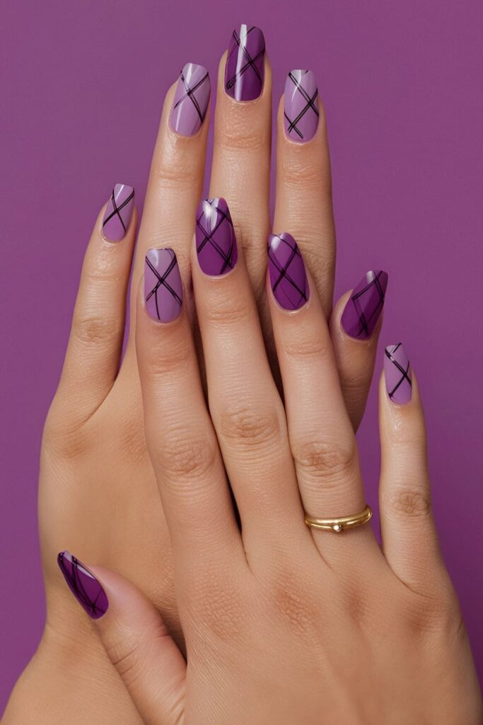 Acrylic nails with different shades of purple forming a classic tartan pattern, perfect for a timeless and sophisticated look