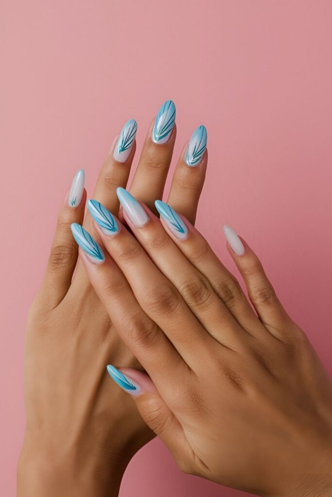 Airy-nails-with-delicate-blue-feathers-painted-on-a-light-or-white-base-adding-elegance-and-whimsy