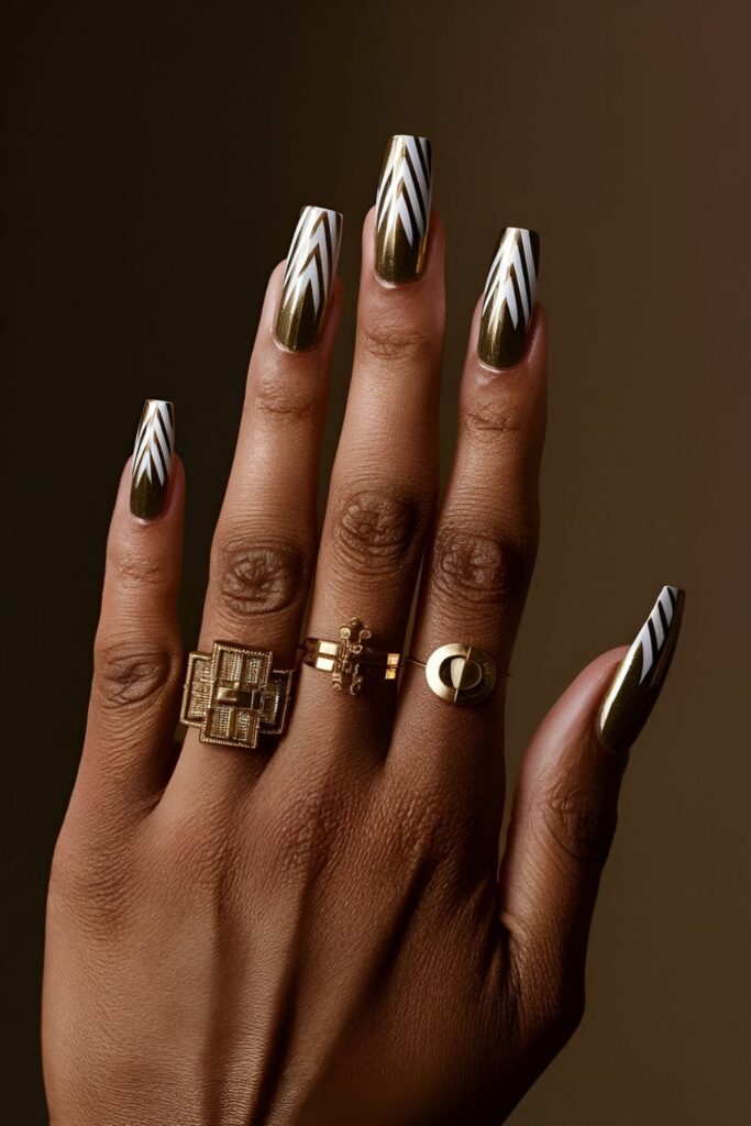 Art Deco-inspired nails with bold geometric shapes and gold accents