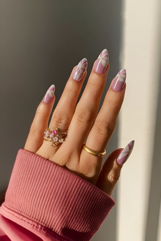 Aura nails with delicate floral-inspired shades of pinks, purples, and whites for an elegant spring design