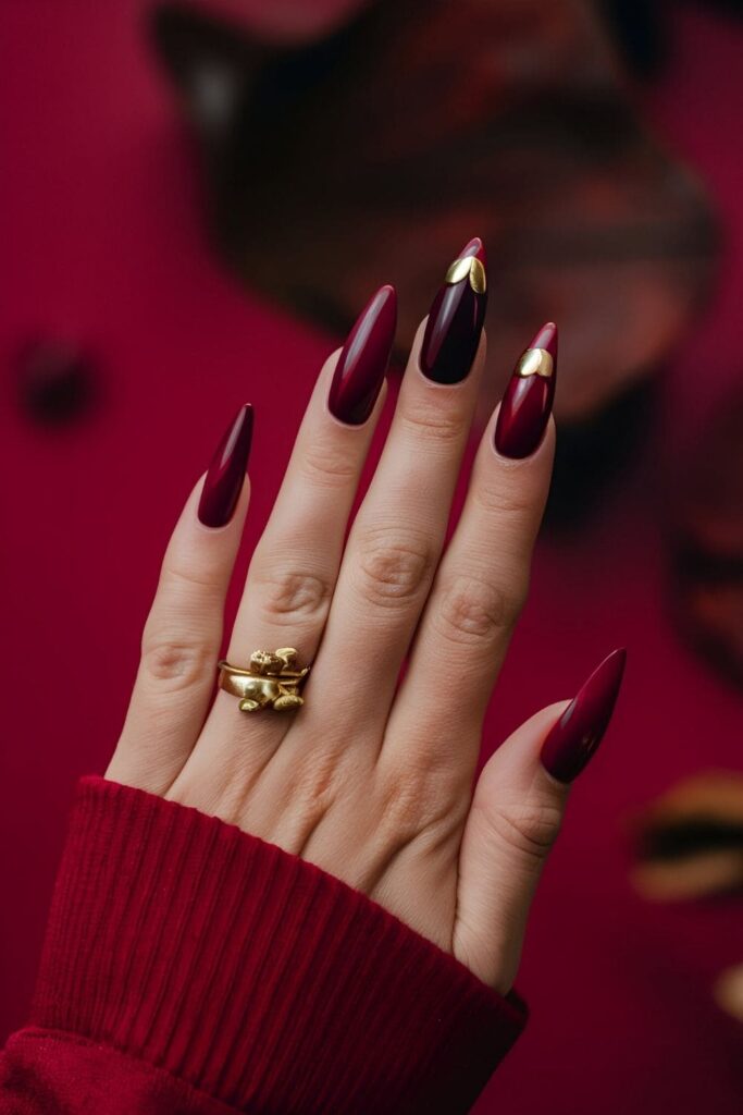 Aura nails with rich berry tones like deep red, plum, and raspberry for a bold fall or winter look