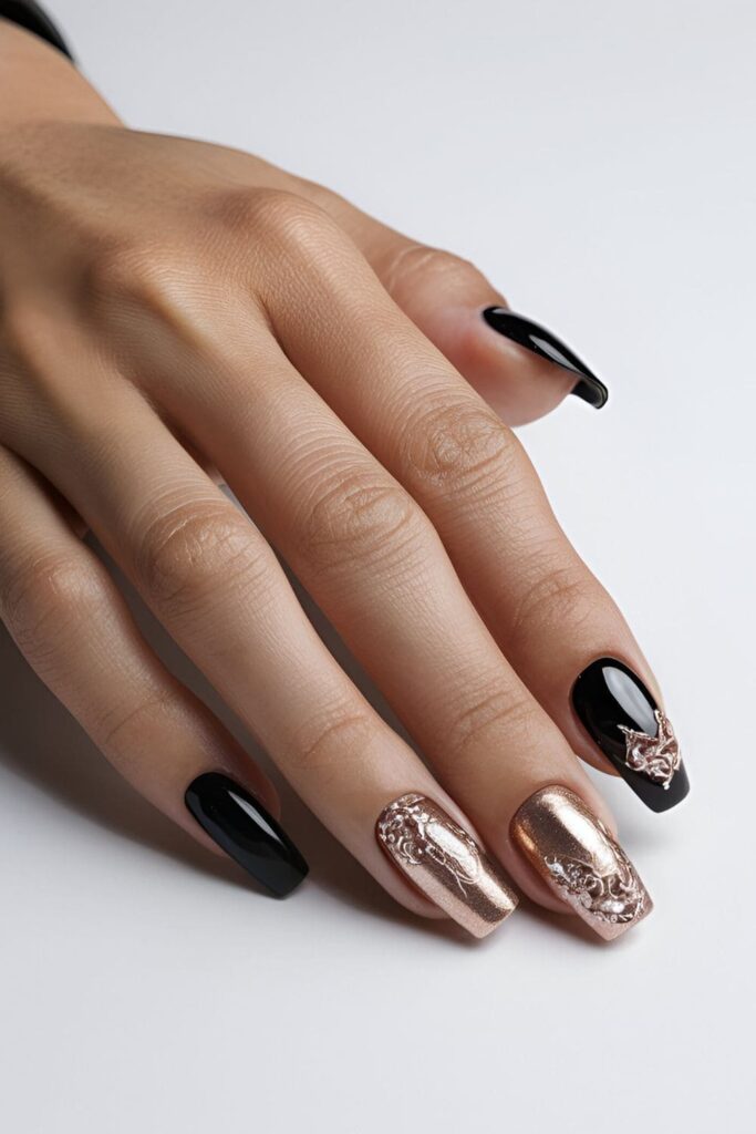 Black acrylic nails with luxurious rose gold foil and glitter accents, perfect for a chic look