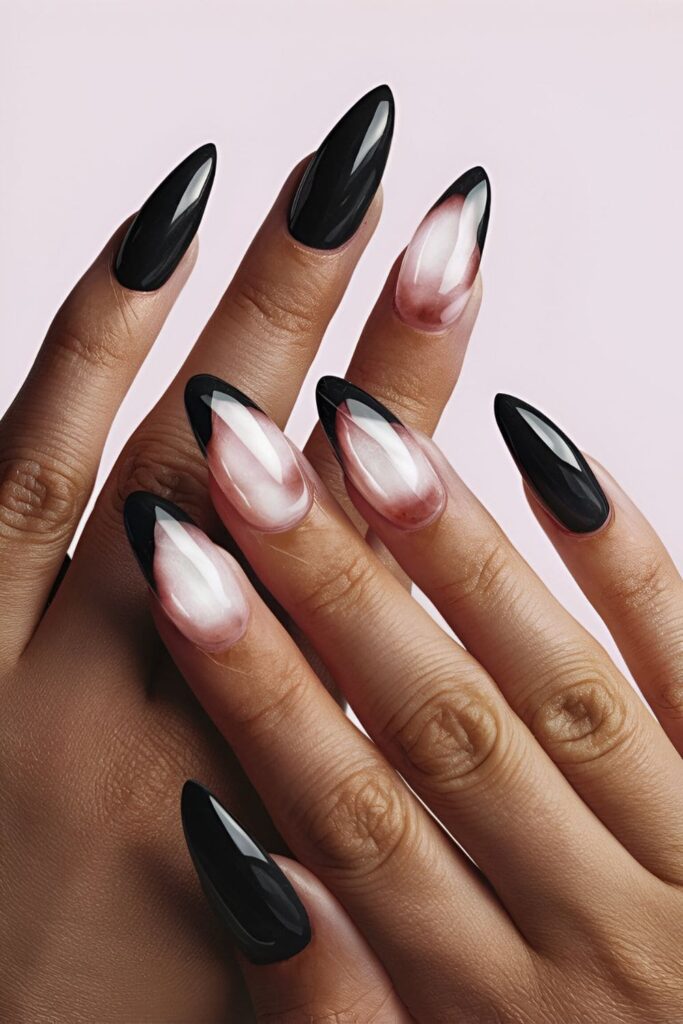 Black acrylic nails with rose quartz effects in soft pinks and whites, creating a mystical and elegant look