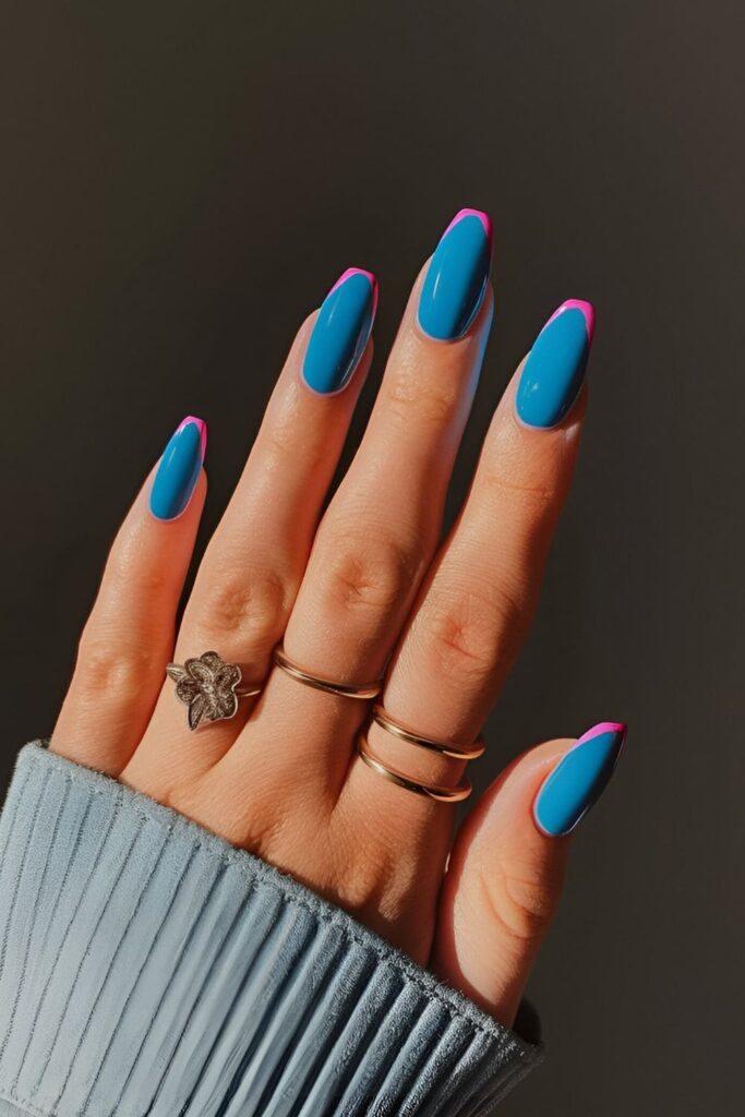 Bold electric blue nails with vibrant neon tips