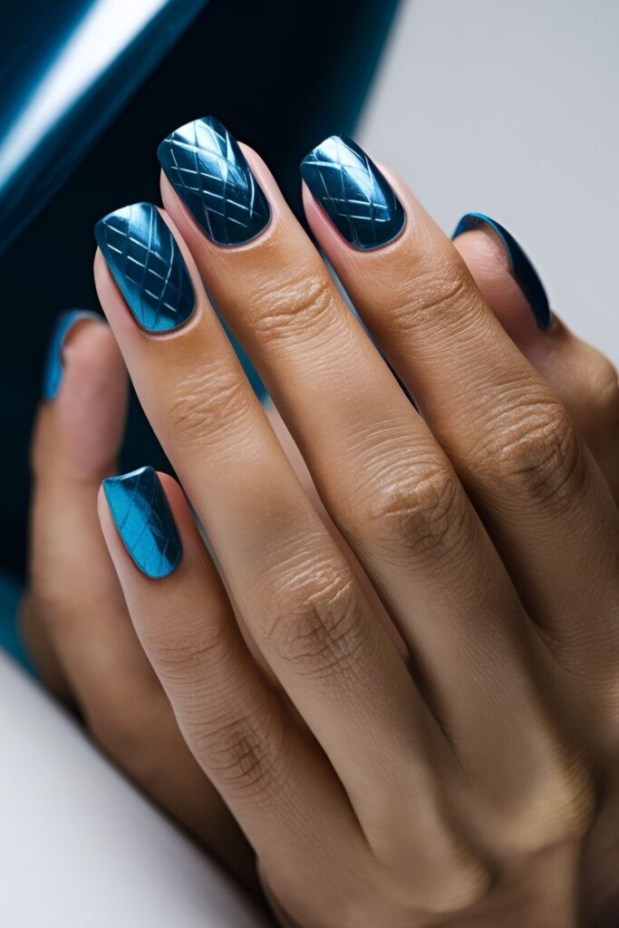 Bold-nails-with-metallic-blue-polish-giving-a-shiny-and-reflective-look