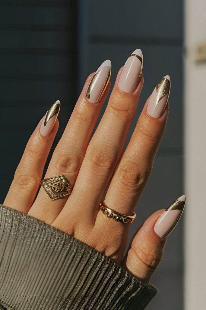 Clean and elegant gold and white acrylic nails with geometric designs, offering a chic and versatile style