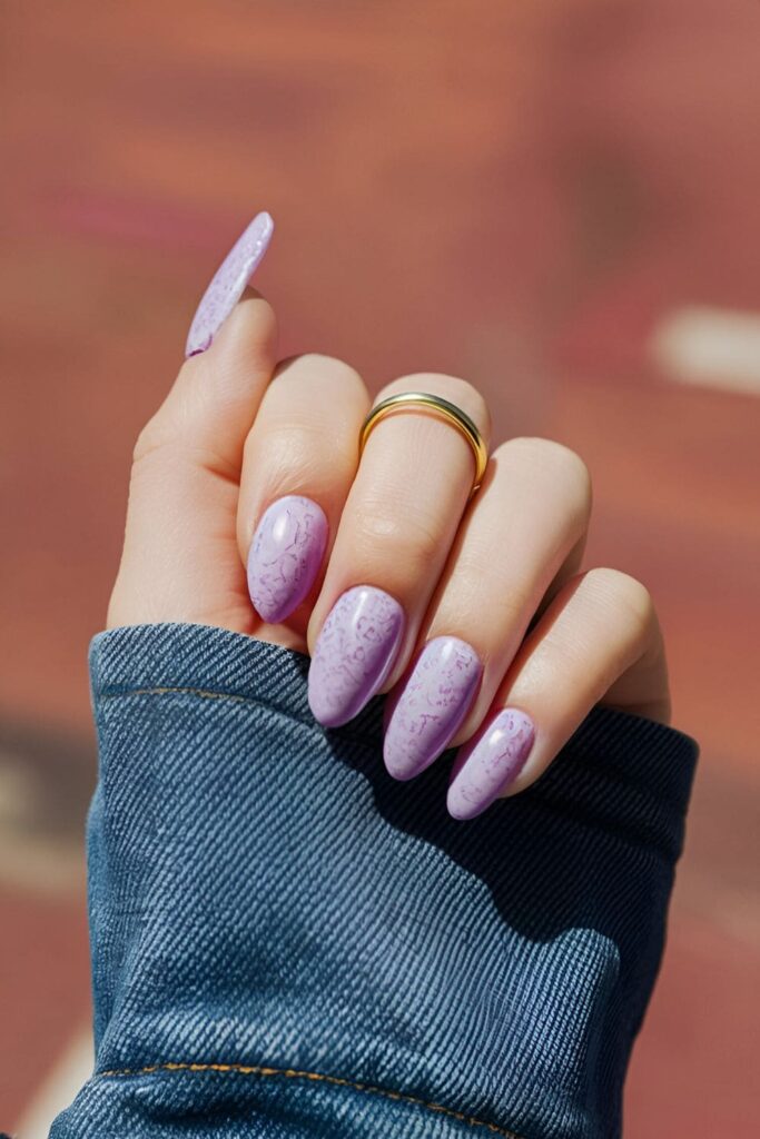 Cool and casual orchid nails featuring a denim texture created with a sponge or brush