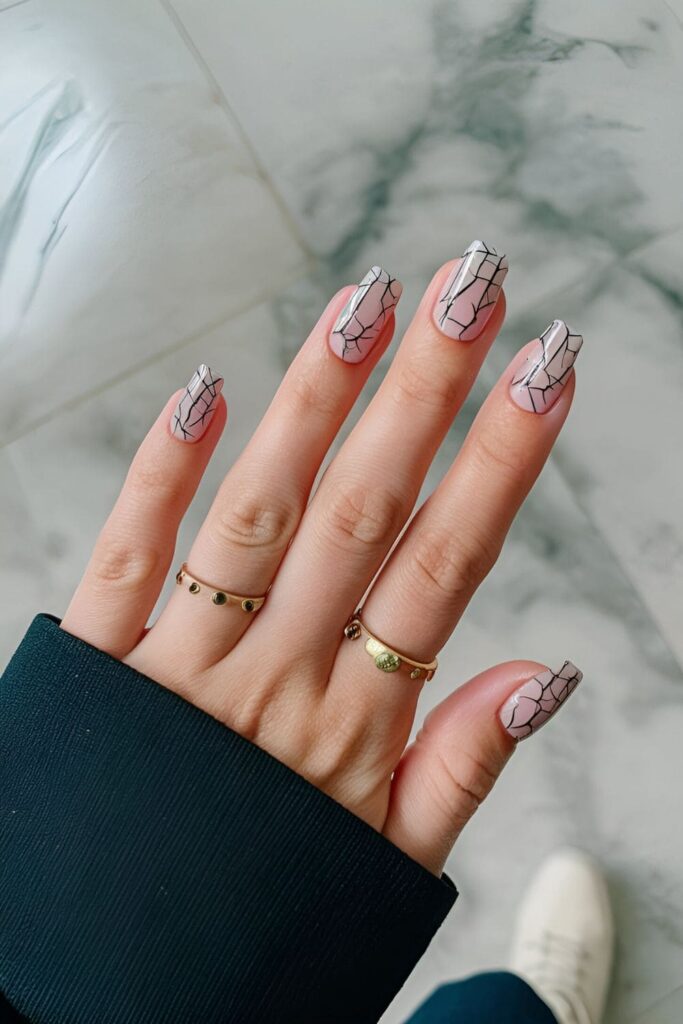 Crackle effect nails with a cracked topcoat revealing a contrasting base