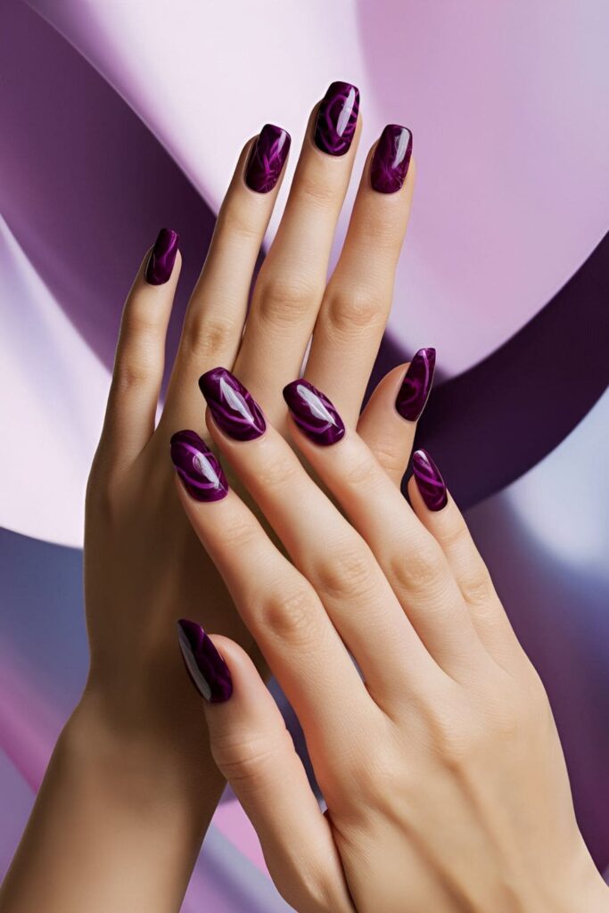 Deep bold orchid nails making a dramatic statement with their striking color