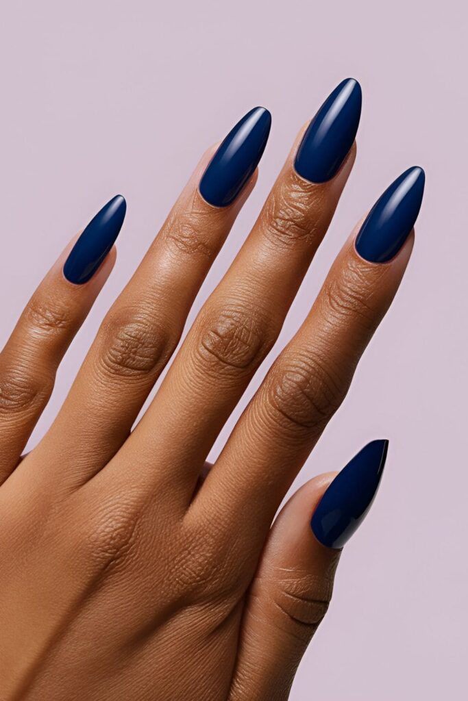 Deep, rich blue acrylic nails, vibrant and eye-catching, perfect for a cool, stunning look