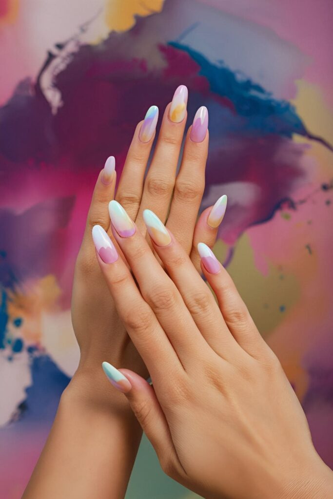 Dreamy acrylic nails with soft, blended colors mimicking watercolor paintings, set against an artistic background