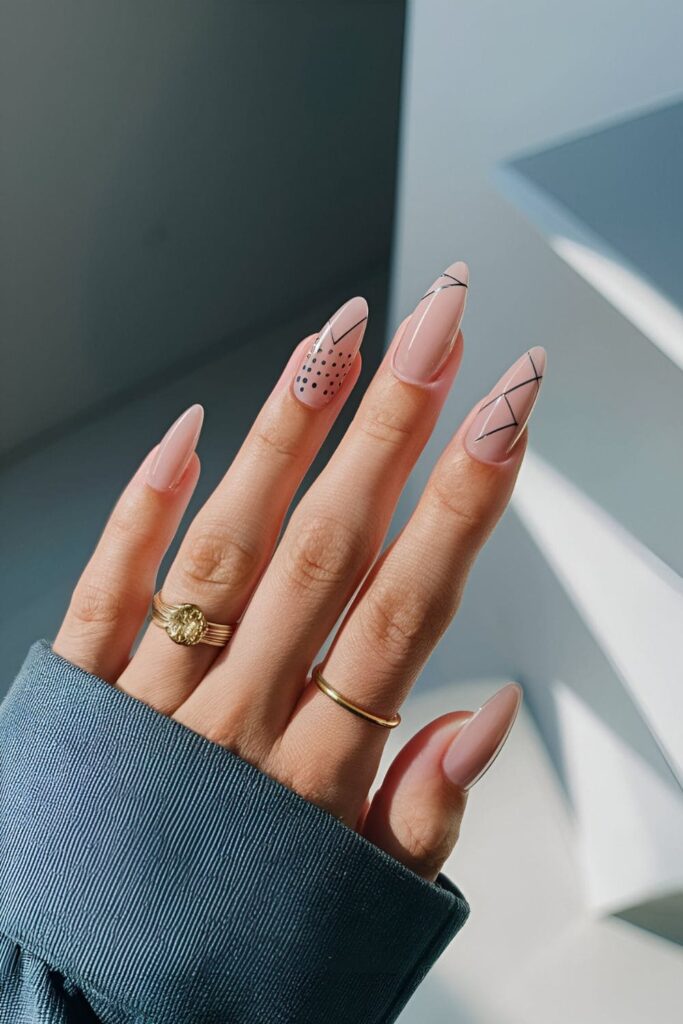 Elegant acrylic nails with simple lines, dots, and geometric shapes on a nude or clear base, set against a minimalist, modern backdrop