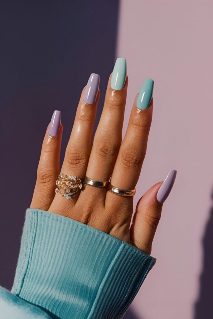 Ethereal nails in lavender, mint, and baby blue shades with a glossy topcoat