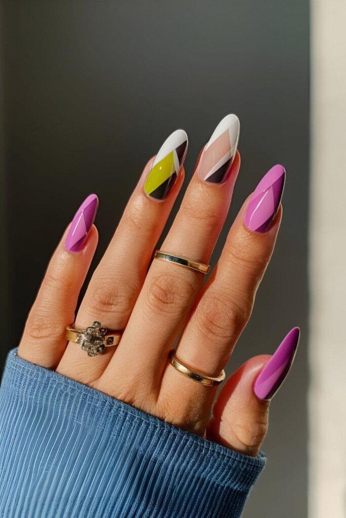 Fashionable color-blocked orchid nails with geometric shapes and bold contrasting colors