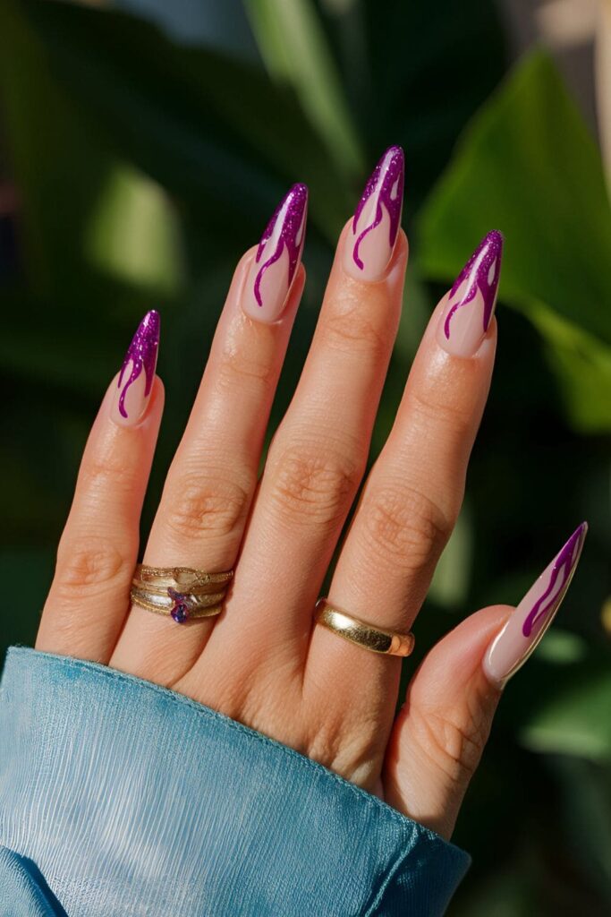 Fierce orchid nails with glittery flame patterns for an eye-catching effect