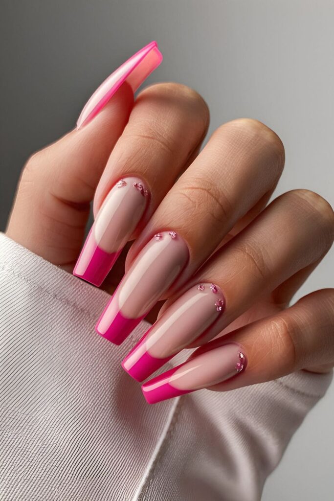 French tip pink coffin nails with a nude base and vibrant pink tips