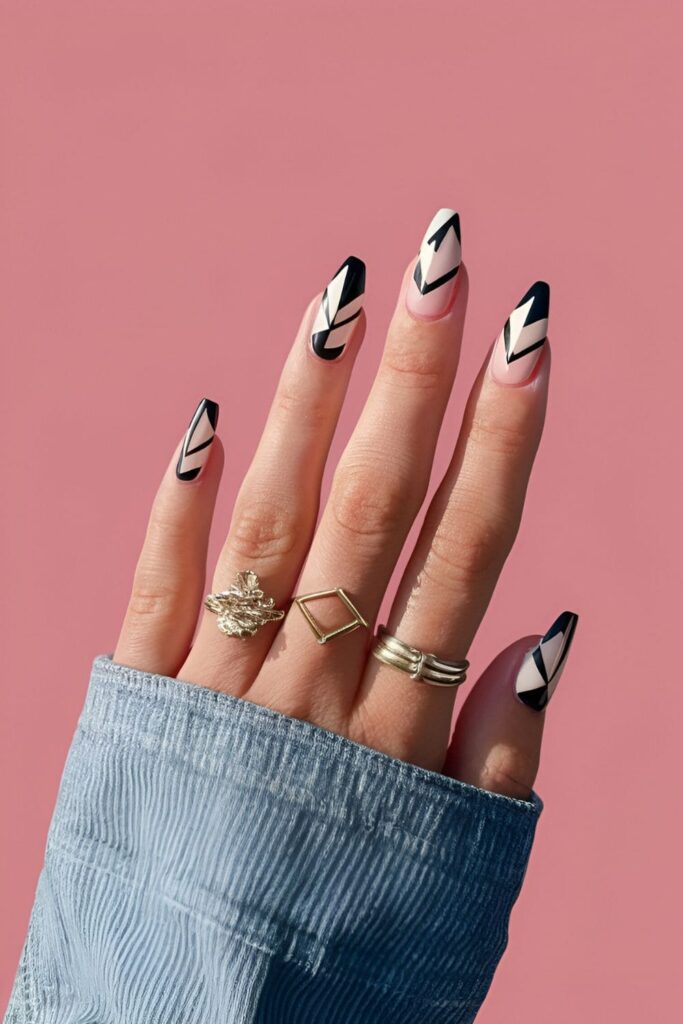 Geometric chic nail design with sharp lines and triangles in black and white