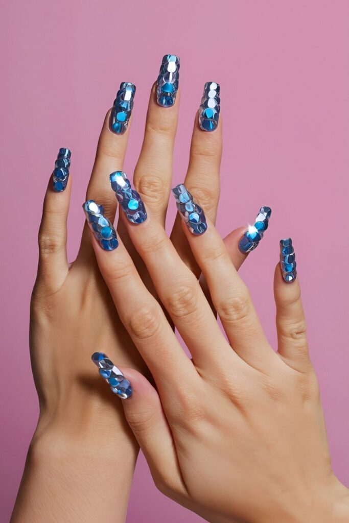 Glamorous-nails-with-blue-rhinestones-on-a-matching-base-adding-extra-sparkle-and-dazzle