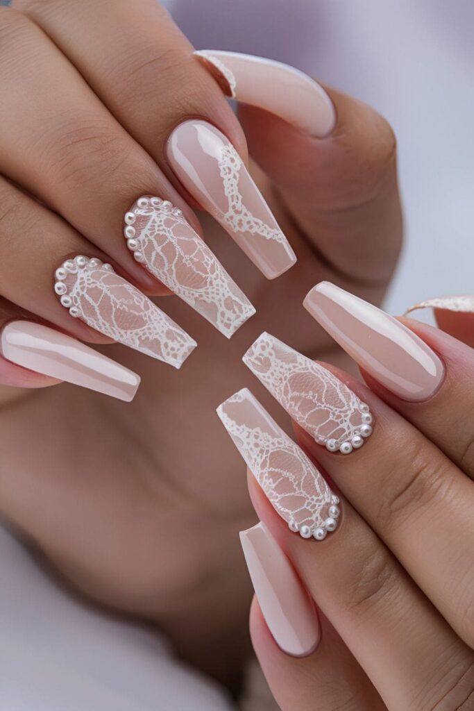 Lace and pearl nail art on nude base