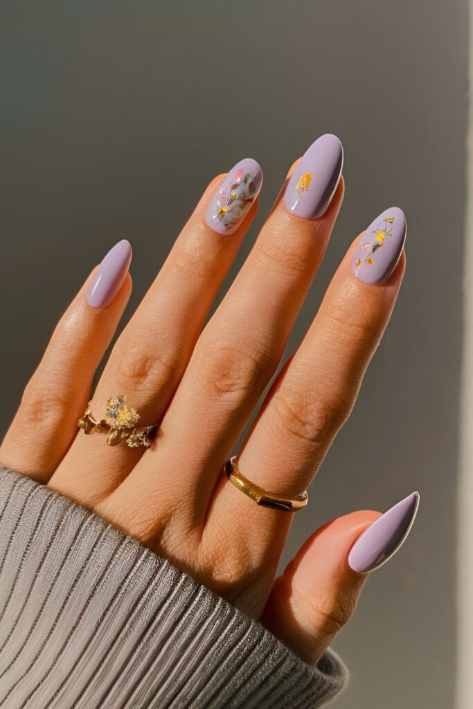 Lavender nails with small, intricate floral accents in soft colors for a calming fall look