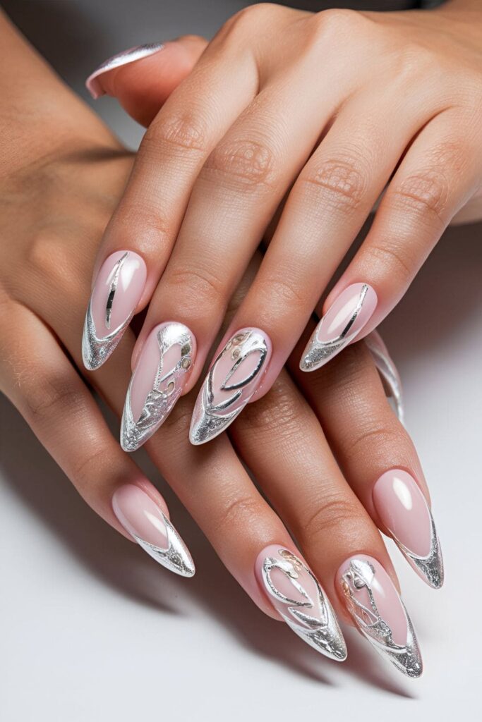 Luxurious pink acrylic nails with silver and gold metallic foil accents