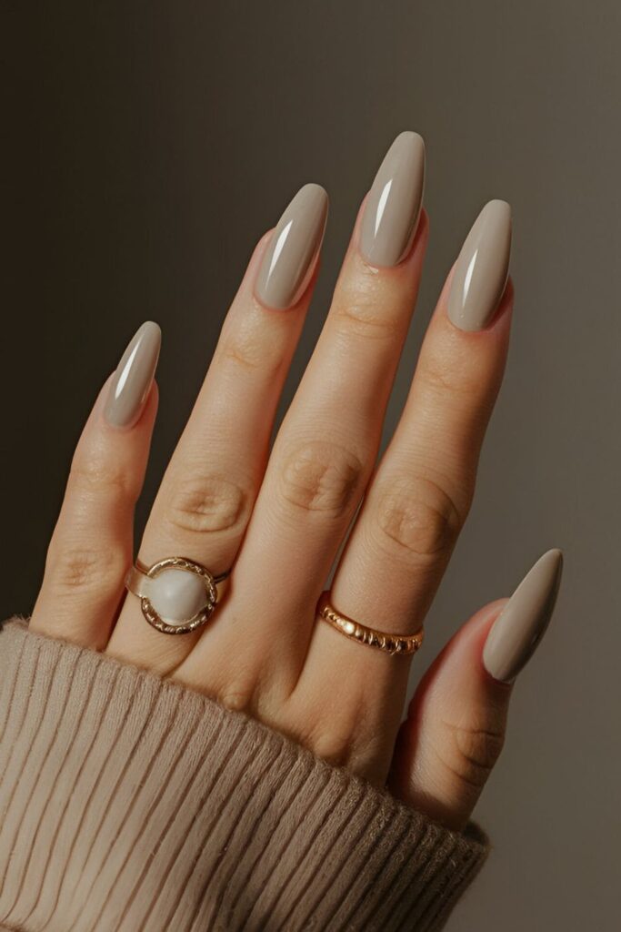 Matte finish acrylic nails in neutral colors like beige or gray, offering a chic and modern texture