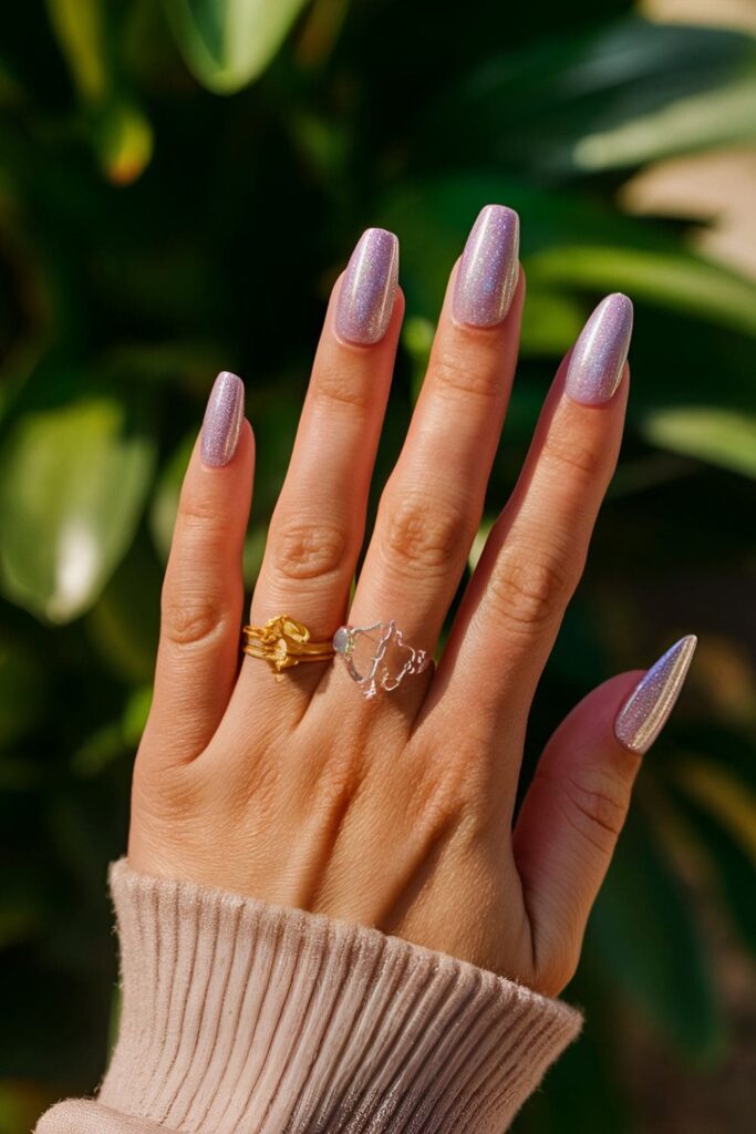 Mesmerizing orchid nails with a holographic top coat that changes colors in the light