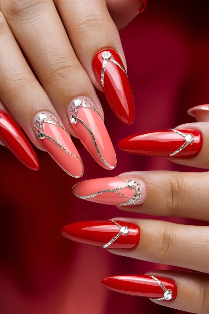 Nails alternating between red and coral, or blended in an ombre effect, looking bright and cheerful