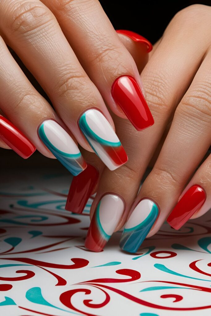 Nails alternating between red and aqua, or blended in an ombre effect, appearing fresh and vibrant