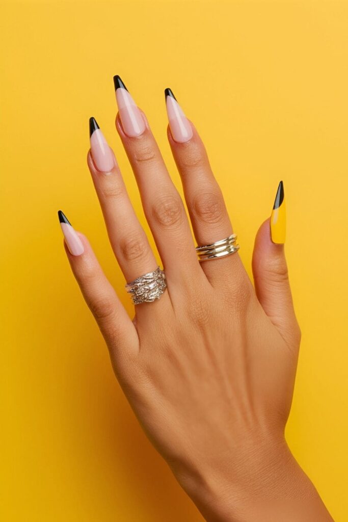 Nails designed to resemble miniature pencils with a yellow main body, silver ferrule, pink eraser, and thin black tip