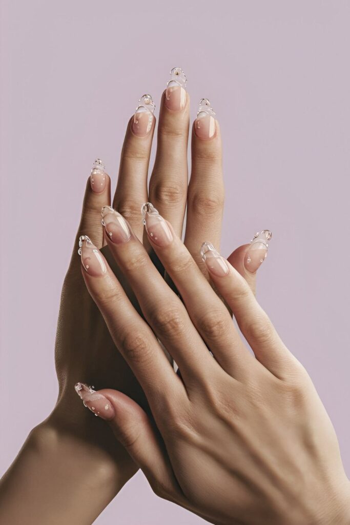 Nails featuring a water droplet effect with small, clear droplets over a solid color, mimicking fresh dew