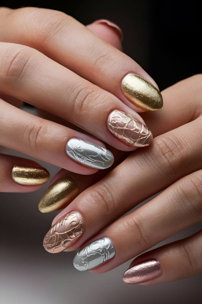 Nails featuring modern and chic foil accents in gold, silver, or rose gold, creating abstract patterns