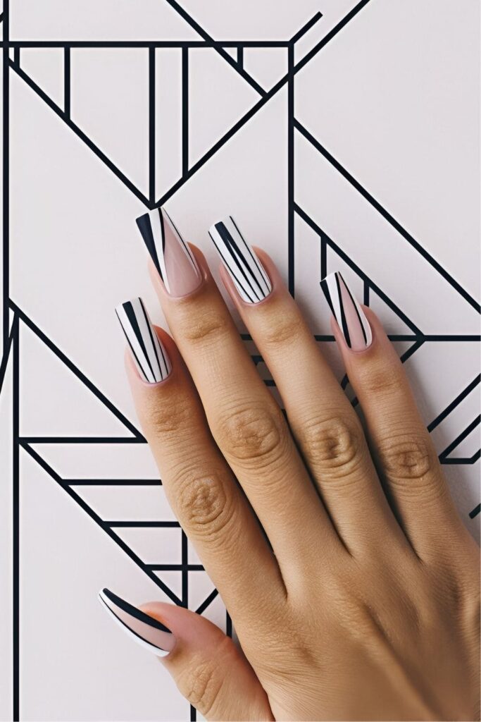 Nails featuring sharp geometric lines and cool shapes, created using tape or stencils for a trendy and modern look