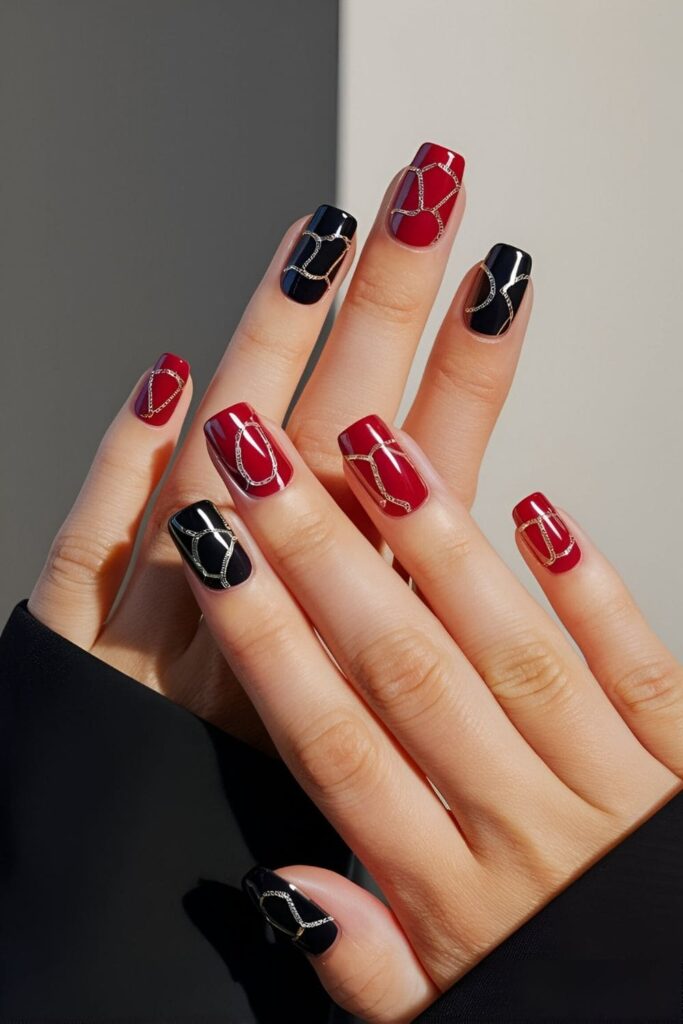 Nails featuring simple chain patterns in metallic polish or decals on a solid base color adding an edgy and stylish vibe