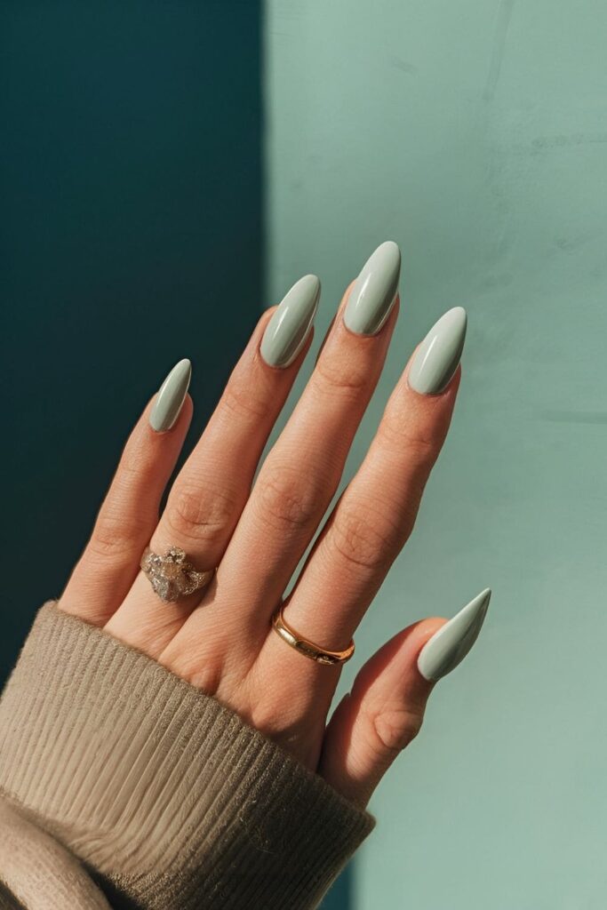 Nails in a cool mint green shade, offering a fresh and modern appearance with a polished and youthful touch