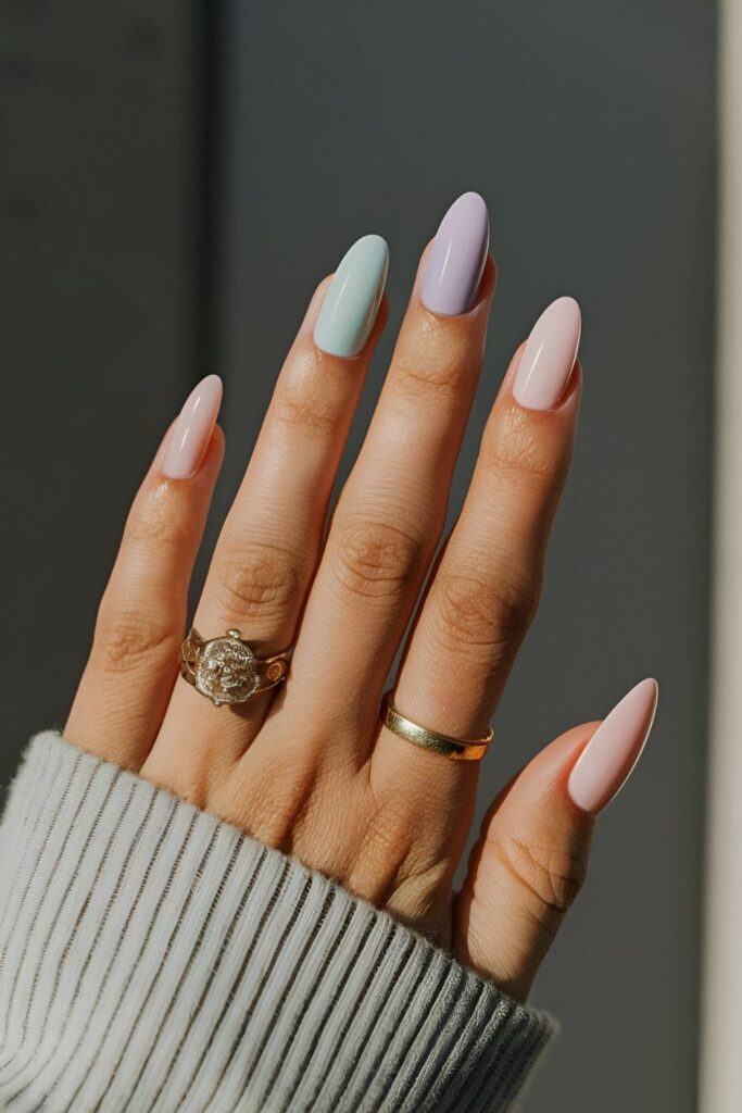 Nails painted in soft pastel colors like pink, mint, lavender, and baby blue ideal for a subtle and fresh look