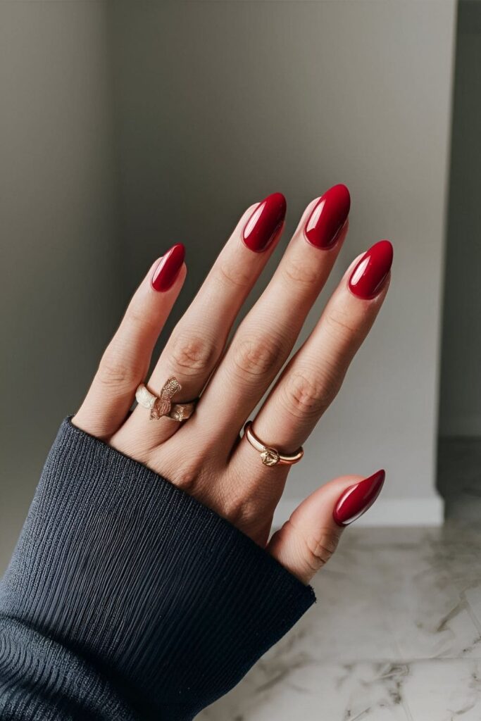 Nails with a classic red gel polish, featuring a glossy finish that enhances the vibrancy of the red color for a bold and elegant appearance