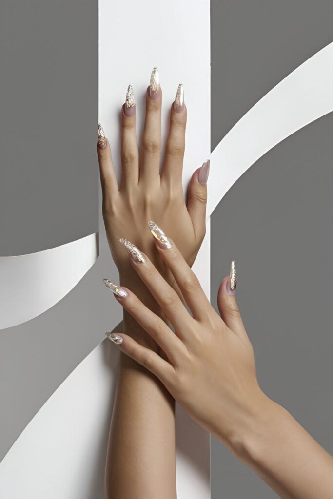 Nails with a high-shine chrome finish in silver or rose gold, offering a futuristic and glamorous look