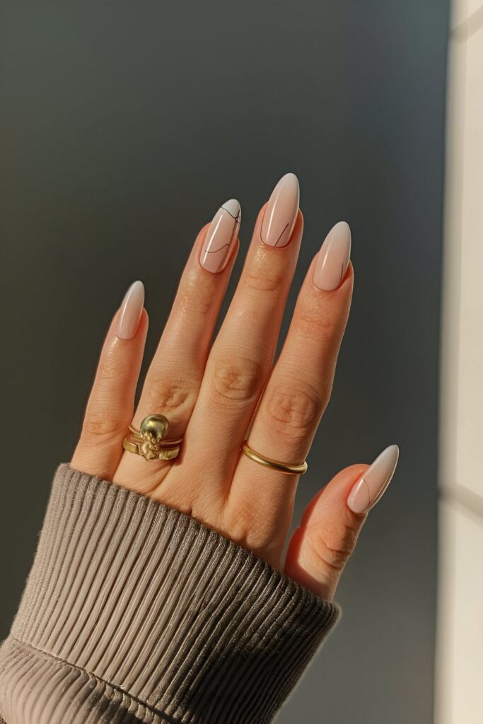 Nails with a neutral base, featuring minimalist line art designs like simple lines and shapes, for a modern appearance