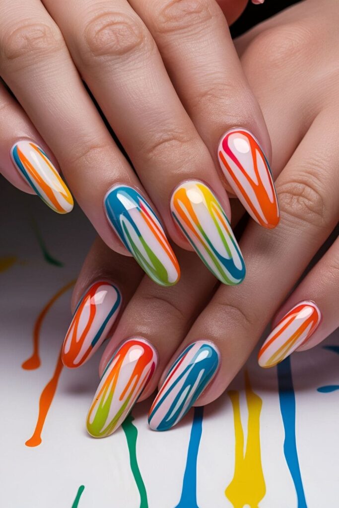 Nails with artistic drip patterns in various colors