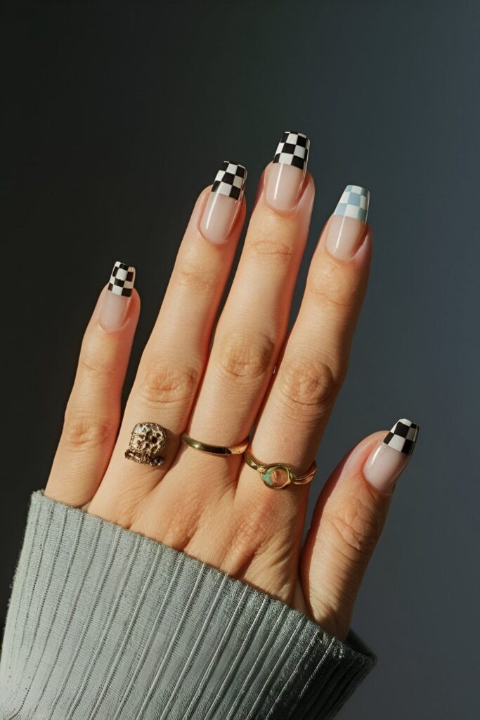 Nails with checkered tips in contrasting black and white or pastel shades adding a unique twist to classic design