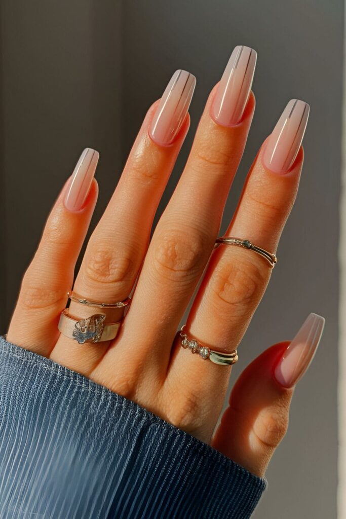 Neutral base acrylic nails with thin vertical, horizontal, or diagonal lines for a sleek, modern look