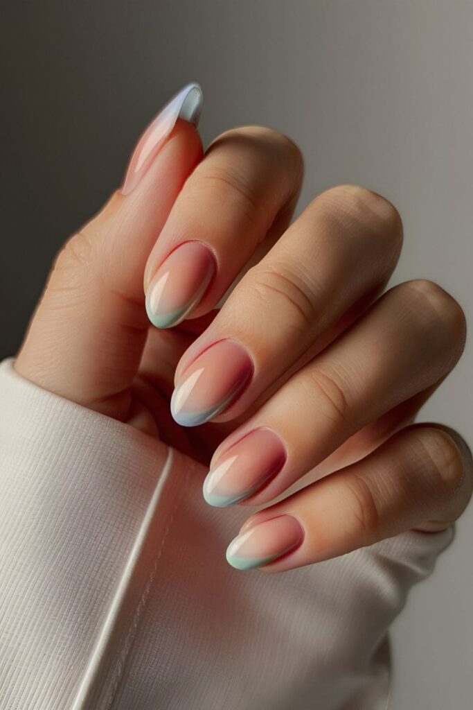 Ombré fade nail design with a gradient of blue shades