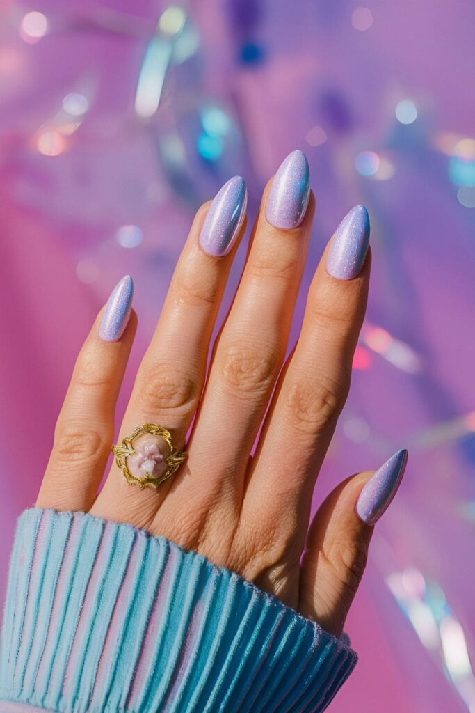 Pastel pink, lavender, and mint nails with a holographic finish that creates an ethereal glow
