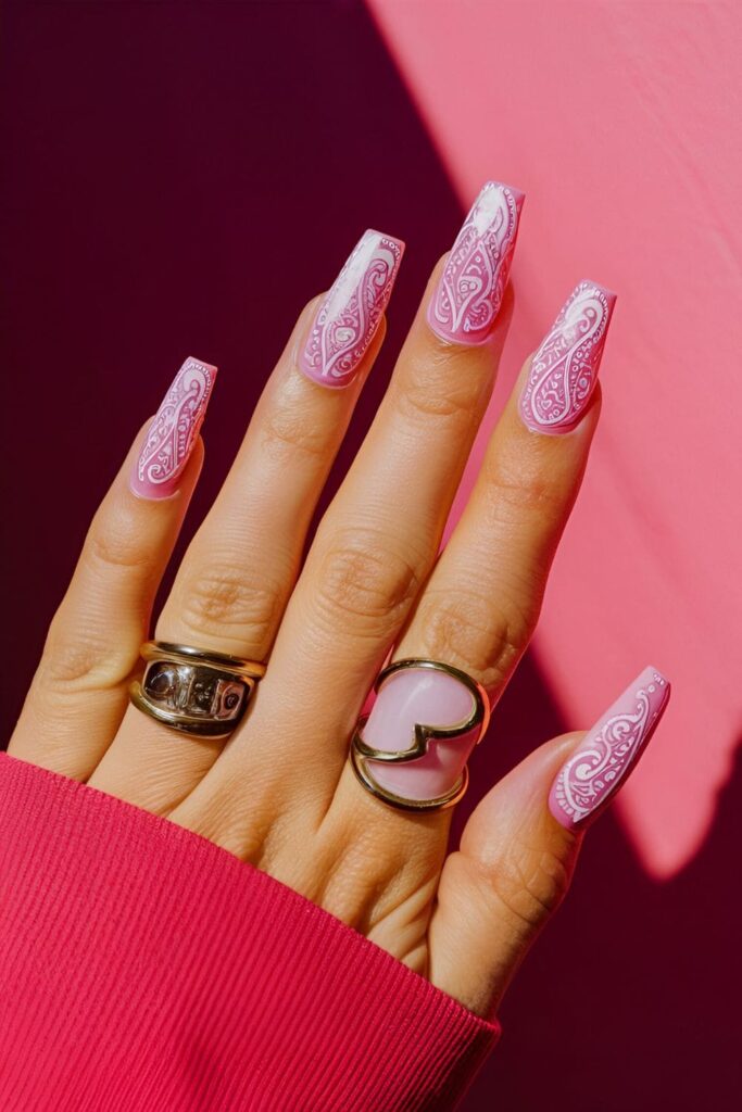 Pink coffin nails with intricate white paisley designs