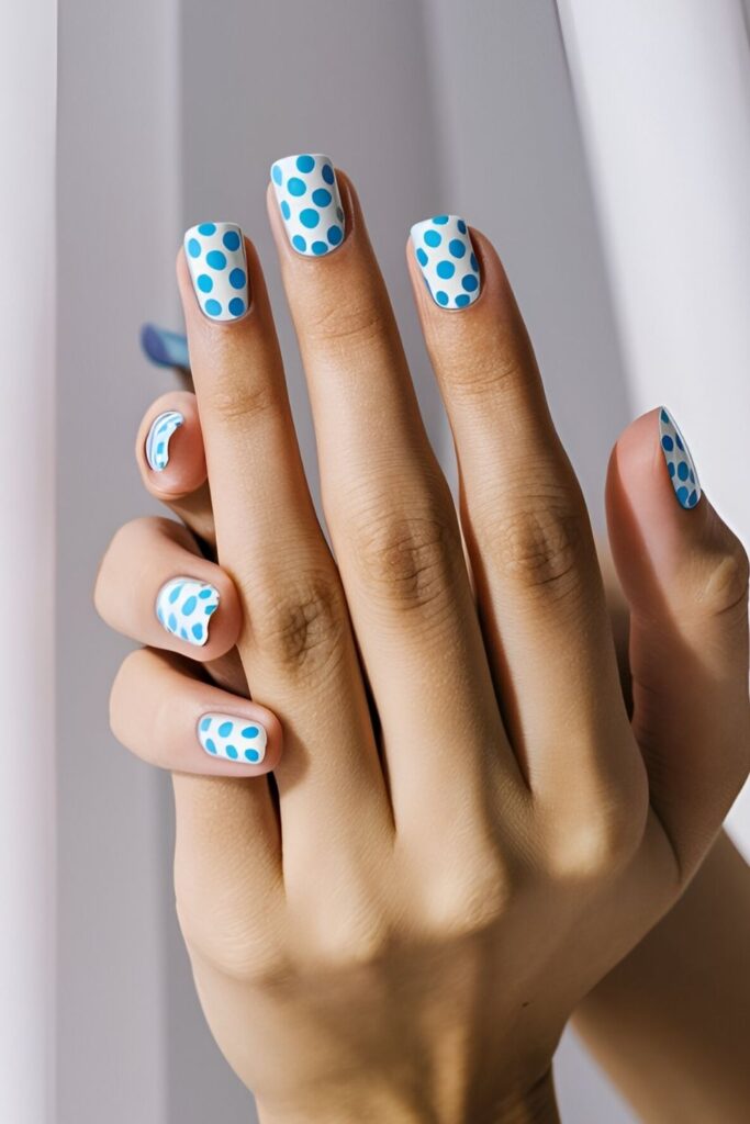 Playful-nails-with-white-polka-dots-on-a-blue-base-or-blue-polka-dots-on-a-white-base-for-a-retro-look